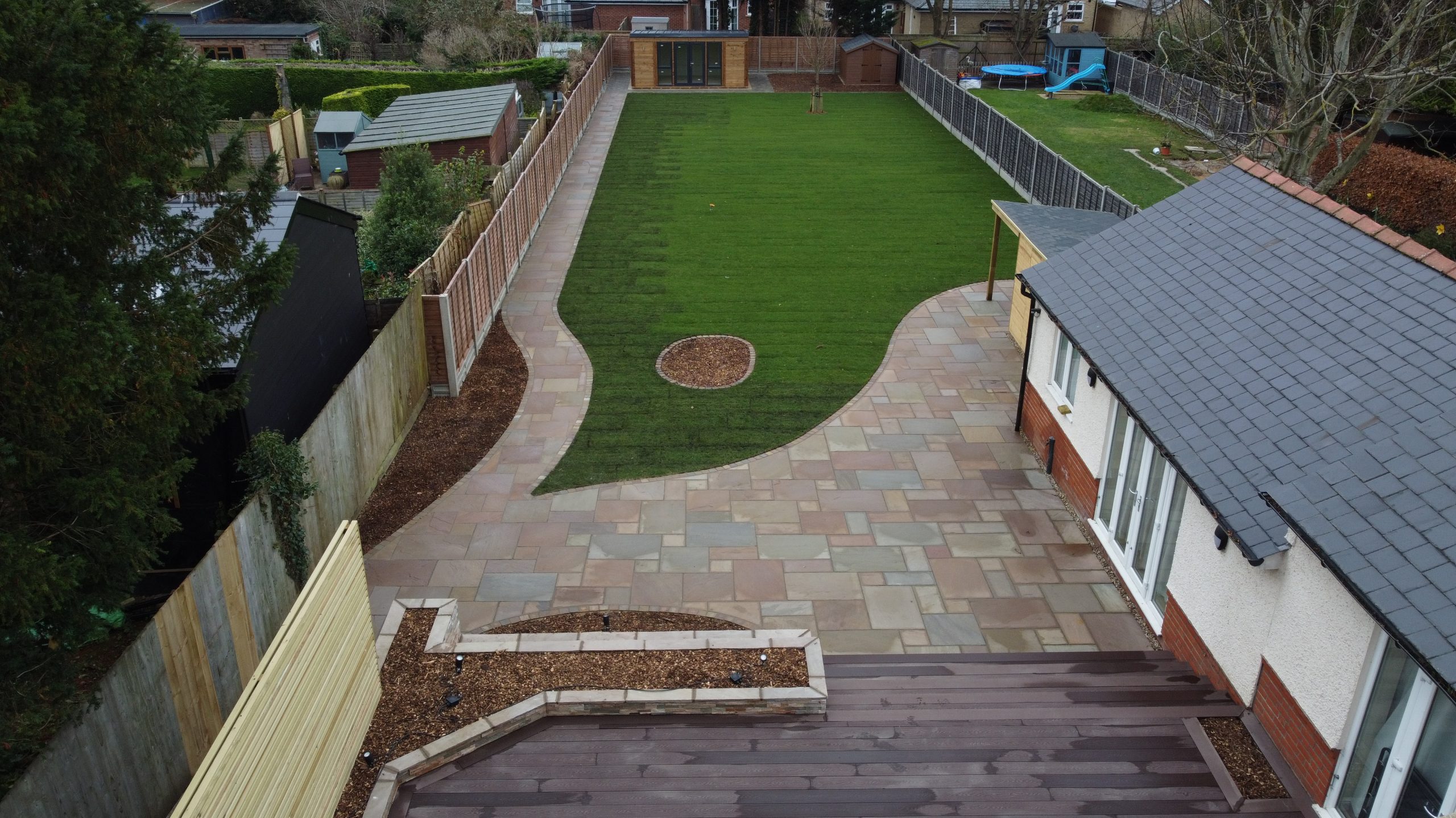 Tiered Garden with natural stone paving and lawn - Cambirdge Project